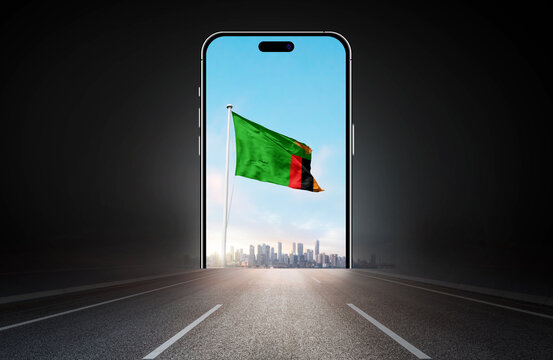 Zambia national flag on phone screen over highway to city. Zambia flag for Republic Day and Independence Day.