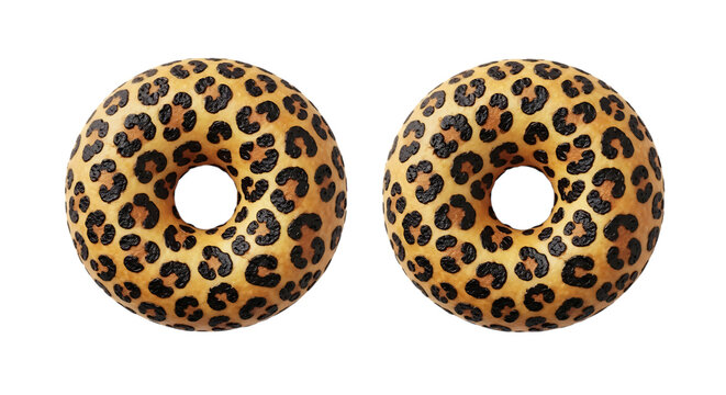 Two leopard print donuts with bite marks on a clean surface isolated on transparent background