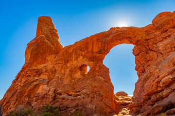Turret Arch frames brilliant sunburst in Arches National Park © PhotoSpirit