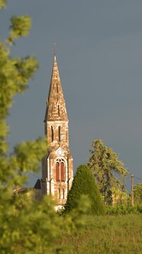 Historic Church Spire Amidst Vineyards in Saint-&Atilde;milion France
