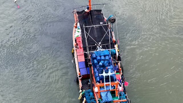 Aerial Overhead View of Fishing Boat Cruising on Water