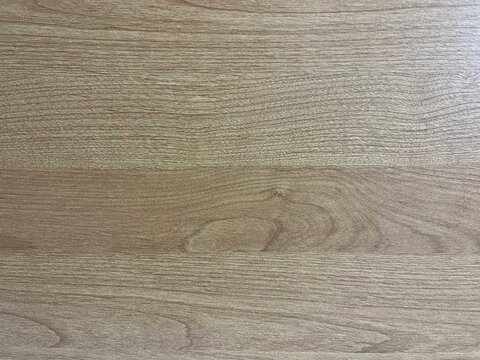 Light brown wood texture background with natural grain. Oak wooden panel texture backdrop for graphic design. Minimalist light oak wood surface with subtle grain lines.