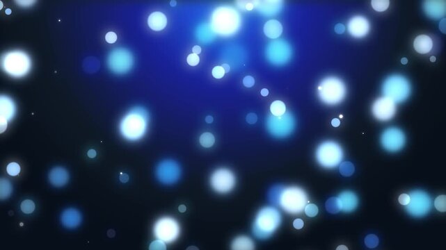 Beautiful bokeh light background with soft glowing blue and white spheres moving gracefully in slow motion