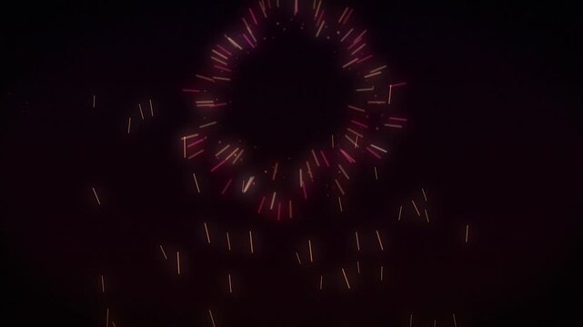 Red and pink firework burst glowing against dark night sky background with falling sparks in motion footage