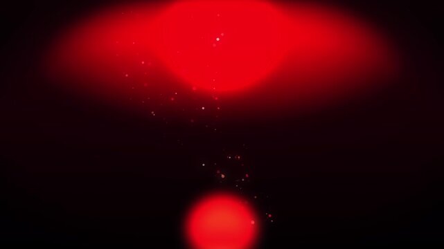 Red glowing orb emitting sparkling particles against dark backdrop for cinematic motion graphics background
