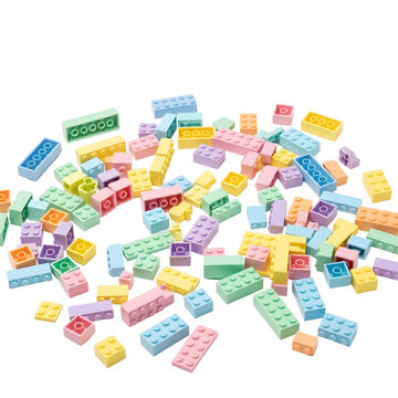 Colorful plastic toy building blocks scattered on transparent background