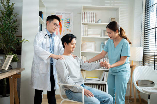 Neurologist explaining brain scan results and conducting physical movement response test with patient in medical clinic,representing healthcare,neurology diagnosis,Health care and technology.