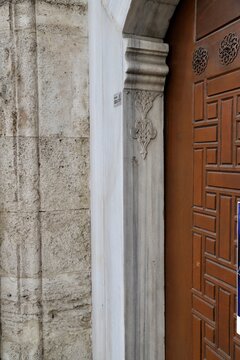 The marble carved decoration on the historic door lintel