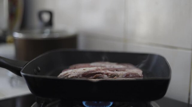Sizzling Beef Steak Grilling On Cast Iron
