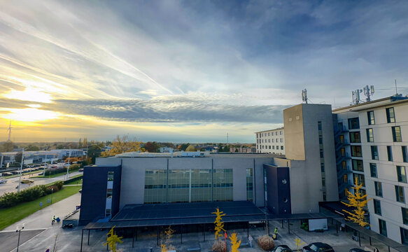 Urban sunset view, Modern campus with golden sunset illumination