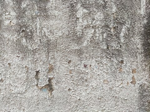 Gray mottled weathered rough concrete wall surface texture for backdrop, architectural design, interior decor, or background in concept art.