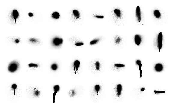 Collection of black spray paint splatter marks isolated on a