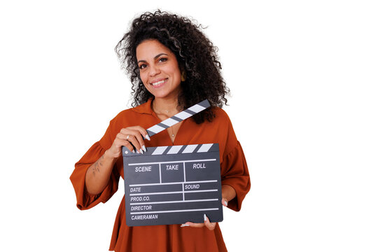 Woman holding a clapperboard smiling, producing a film, making movies, directing, shooting a video
