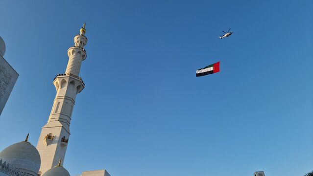 Mosque Minaret and United Arab Emirates Flag Under Blue Sky Sheikh