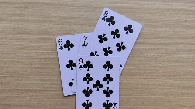 Dealing cards at the table, revealing the poker playing cards.
