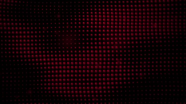 Abstract background with a grid of glowing red spheres or dots, creating a digital matrix pattern on a dark surface