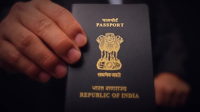 Indian Passport Held In Hand Close Up