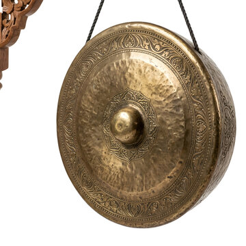 Traditional brass gong hanging on transparent background with ornate carved wooden stand and intricate metallic patterns