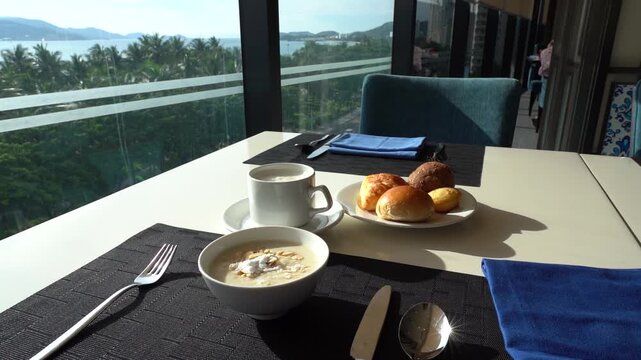 A Serene Morning Breakfast Experience by the Sea with Fresh Pastries, Hot Coffee, and a Stunning Waterfront View