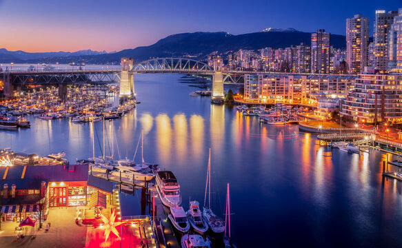 Burrard Bridge and the False Creek marina at dusk seen from Granville Bridge, Vancouver, British Columbia, Canada