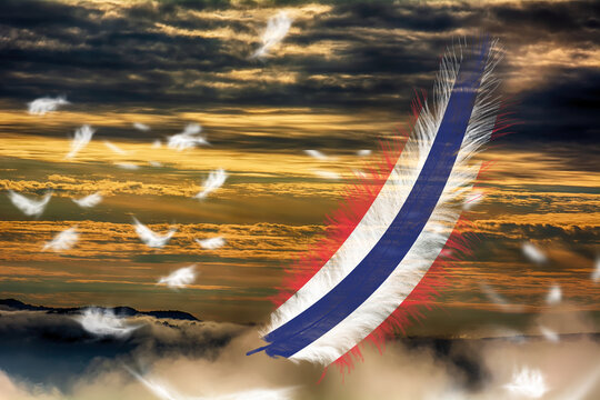 3D illustration. Flag of Thailand on a feathers fluttering in the sky background.