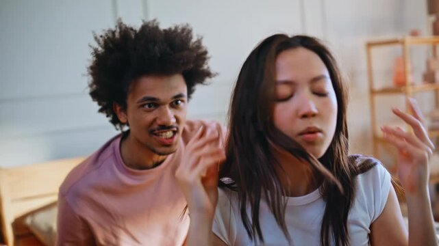 Stressed girlfriend covering ears close up. Angry boyfriend blaming quarrel.