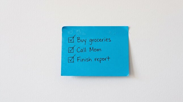 Handwritten to do list on blue sticky note with planning
