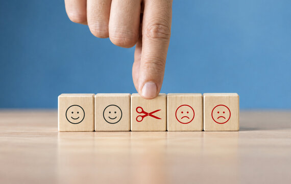 Reducing dissatisfied customers, managing complaints and claims. Bad ratings, bad reviews, customer dissatisfaction, angry. Wooden cube with negative, depression, sadness, mental problem, stress icon.