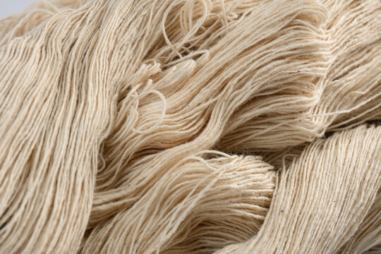 Cream yarn fiber textile thread natural soft closeup material wool texture craft background