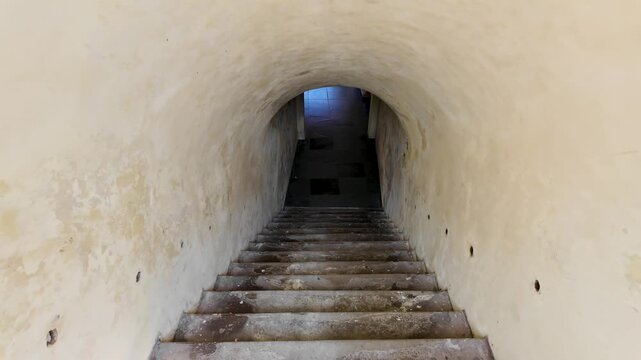 Slow-Motion Descent Down Historic Tunnel Stairs at Fort Rotterdam, Makassar, Indonesia