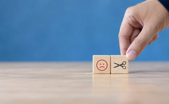 Reducing dissatisfied customers  managing complaints and claims. Bad ratings  bad reviews  customer dissatisfaction  angry. Wooden cube with negative  depression  sadness  mental problem  stress icon.