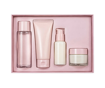 Beautiful pink cosmetic gift set with various skincare products, including a lotion, cream, and serum, elegantly arranged in a box against a clean white background