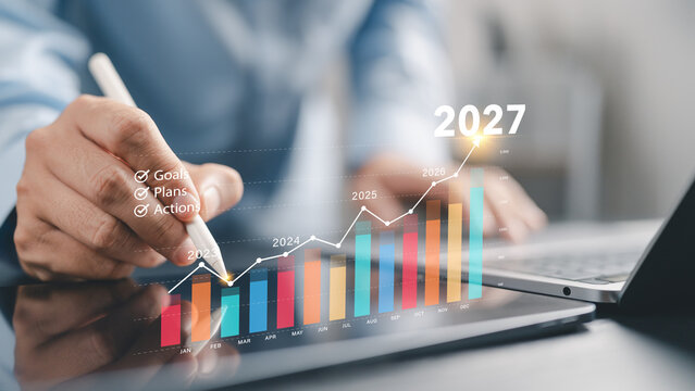 2027 goal and business growth strategy concept. Businessman beginning planning with KPI dashboard financial charts, Development to success and motivation in 2027.