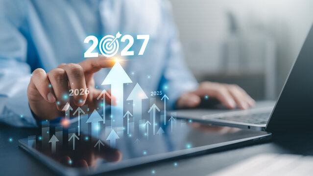 2027 goal and business growth strategy concept. Businessman beginning planning with KPI dashboard financial charts, Development to success and motivation in 2027.