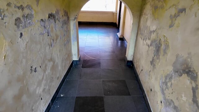 Walking Through Arched Corridor to Courtyard at Fort Rotterdam, Makassar, Indonesia