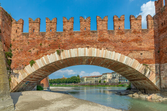 Adige River and fortified  historic Castelvecchio Bridge, also known as the Scaliger Bridge or Ponte Scaligero, Verona,