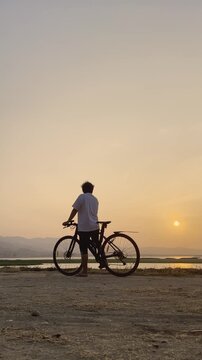 Silhouette of Cyclist at Sunset
