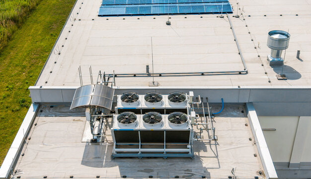 High angle view of HVAC ventilation equipment on commercial roof