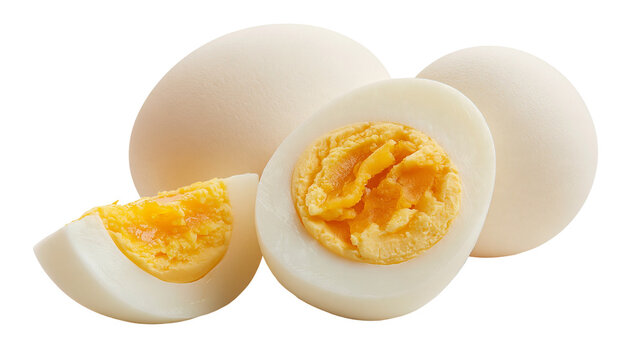 Whole and sliced hard boiled eggs with yellow yolks