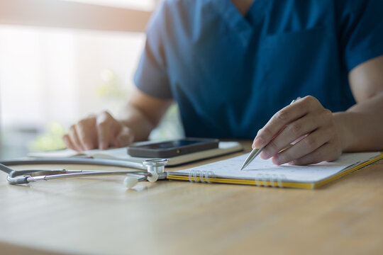doctor write date and time for make appointment to follow up and health checkup annual of patient for insurance and healthy lifestyle concept