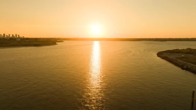Corpus Christi Texas bayfront skyline at golden hour, calm coastal water reflections, modern waterfront architecture and authentic American city scenery