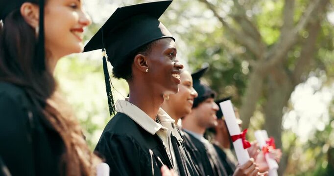 Man, students and diploma at campus at graduation, speech and celebration of degree completion. People, applause and graduate outdoor with regalia, university recognition and educational milestone