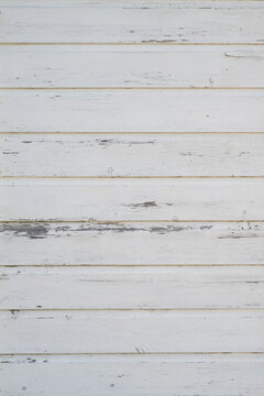 White painted wooden boards with subtle weathering and paint wear