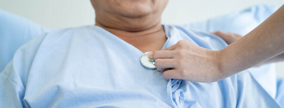 Doctor Hands Using Stethoscope to Examine and Listen to Mature Male Patient Heartbeat
