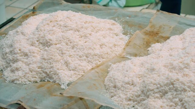 Close up of cooked rice for pilaf drying on cloth