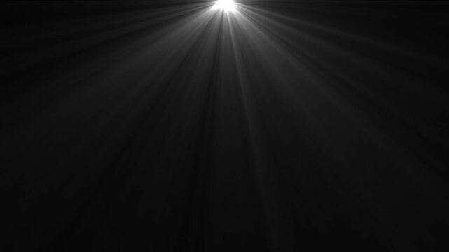 Cinematic white light rays shining downward from above on a deep black background, abstract glowing sunbeam overlay effect, ethereal volumetric lighting flare for motion projects