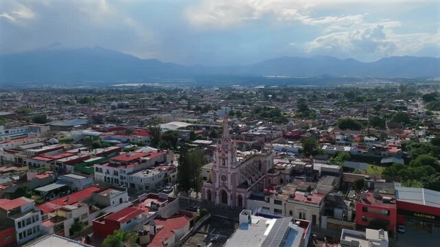 Panoramic orbit of San Antonio de Padua Catholic Church with Ciudad Guzman and Nevado de Colima in the background, Jalisco, Mexico