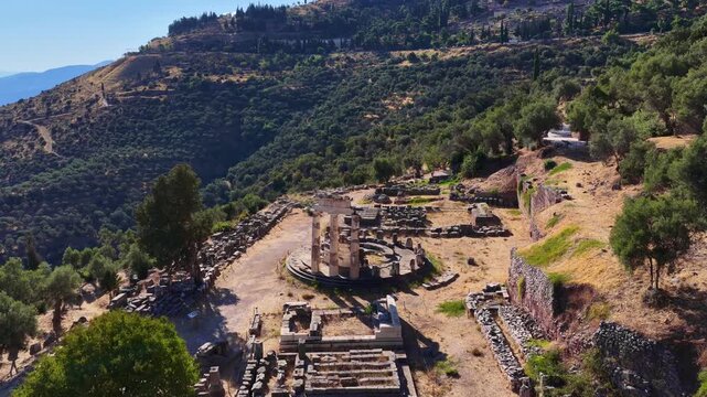 Delphi Ancient Greek temple ruins aerial view, drone shot of marble columns of the temple of Athena in Delphi, Greece, Greek mythology, the site of the ancient oracle of Delphi