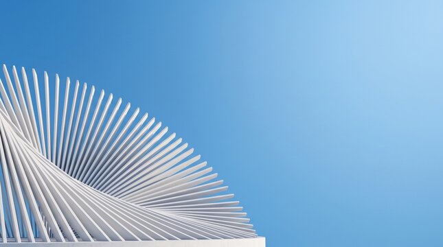 White spiral architectural slats rising against a clear blue sky background