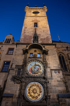 The illuminated astronomical clock decorates the tower at night
